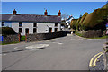 Mini-roundabout and sheep on the road in Llangennith