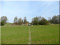 Footpath through a field to a dismantled railway 