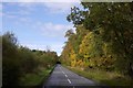 NO3105 : Road past Dykehead Wood by Richard Webb