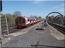 TQ1085 : Train leaving Ruislip Gardens Underground station by Marathon