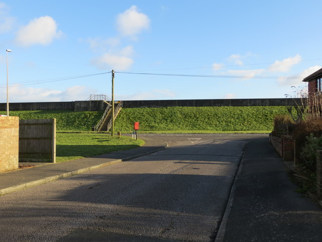 The junction of Marine Avenue with Hythe Road (A259) with Dymchurch Wall beyond