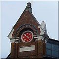 Date stone and weather vane dial