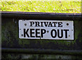 Gate into a field sign