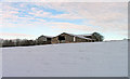 Barns in a snowy field