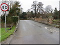 Road over Shalmsford Bridge heading to its junction with the A28