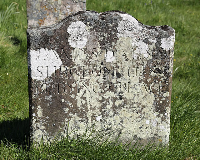 An old gravestone at Lennel Parish Churchyard