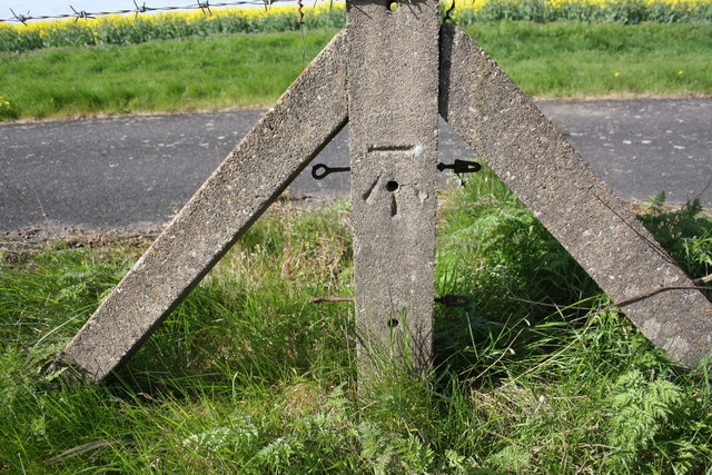 Benchmark on fence post beside Dalby Road