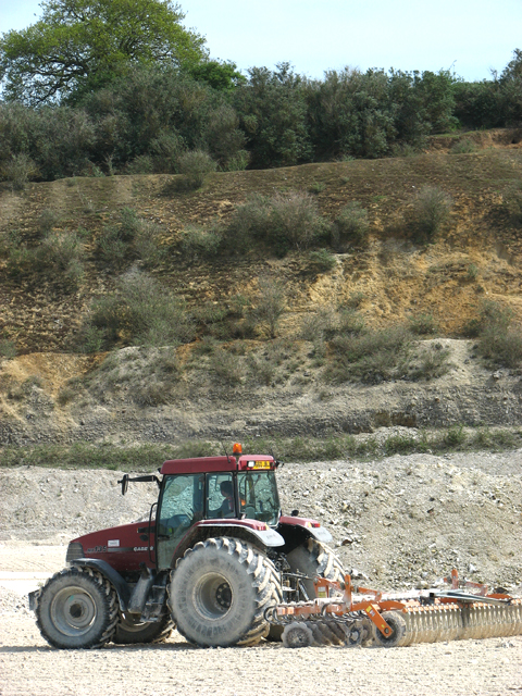 Tractor working at the quarry bottom