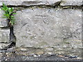 Bench mark on the wall in Castle Lane