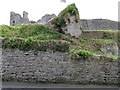 Castle Lane wall, the castle and a bench mark