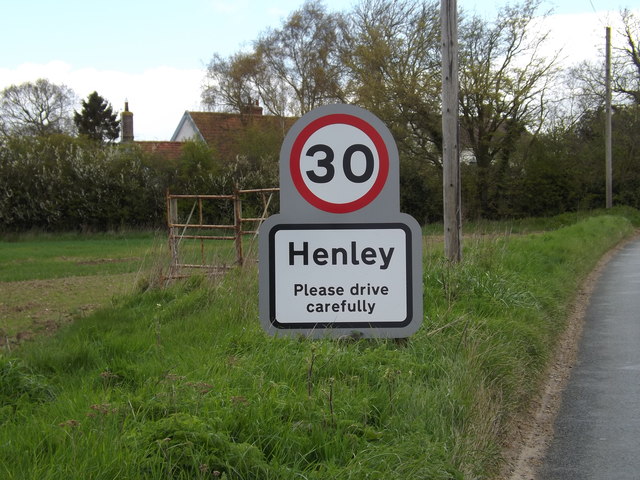 Henley Village Name sign on Main Road