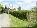 Looking north on Staplefield Lane from footpath junction