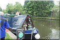 View of a narrowboat moored on the Grand Union Canal near Batchworth Lock #3