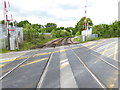 Looking along railway from crossing on Nye Road