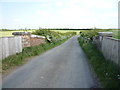 Looking south east from the disused railway bridge near Raby Cote