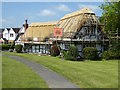 Cottage being thatched