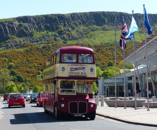 Vintage bus passing the Scottish Parliament