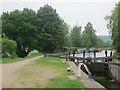 Walkers by the canal passing Northchurch Lock