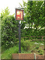 TM0954 : The Lion Public House sign by Geographer