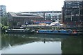 View of the Plough Cafe and "The Great Stage" street art from the River Lea towpath