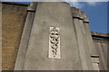 TQ3881 : View of an emblem on the Old East India Dock Yard wall on Leamouth Road by Robert Lamb