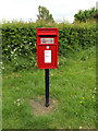 TM0157 : Post Office High Road Postbox by Geographer
