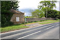 Burton Park lodge and bus stop beside A684