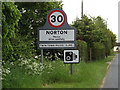 TL9565 : Norton Village Name sign on the A1088 by Geographer