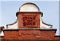 Gable end and ghost sign in terra-cotta, St Albans