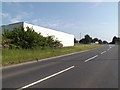TL8684 : A1066 Mundford Road & Industrial Building by Geographer