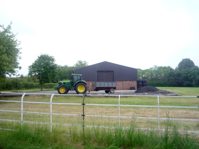 Farm building and tractor off Sandhole Lane