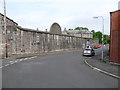 The prison wall from the junction of Grove Terrace and George