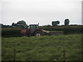 NY1232 : Tractor raking mown grass by Graham Robson