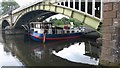 Boat moored beneath railway bridge at Richmond