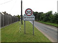 TL9585 : Bridgham Village Name sign on The Street by Geographer