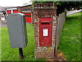 King George VI postbox in a wall on a Lydney corner