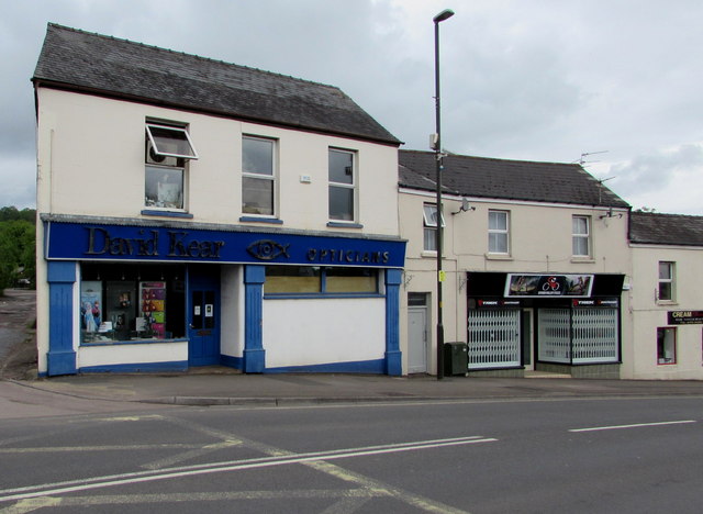 Opticians and a bicycle shop in Hill Street, Lydney