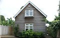 View of a weatherboarded house on Riverside