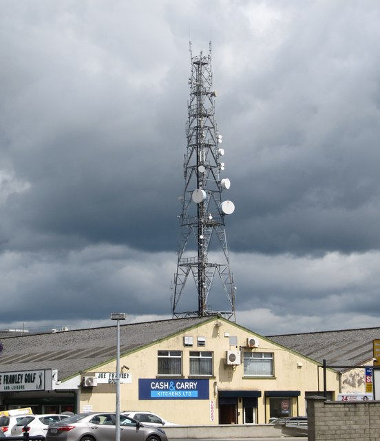 Telecommunications mast appearing to tower above Cash and Carry Kitchens
