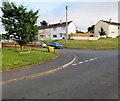 Yellow grit box and a tree on a corner of Pillmawr Circle, Malpas, Newport