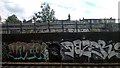 TQ2474 : Graffiti on former railway viaduct, between Wandsworth Town and Putney by Christopher Hilton