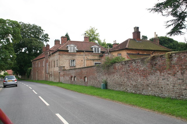 Brick wall and buildings, Main Road, Saxby All Saints