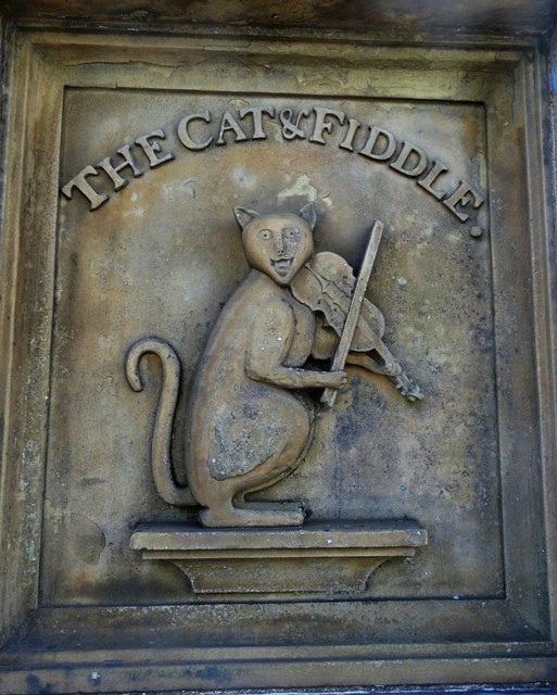 "Cat and Fiddle" carved stone frieze
