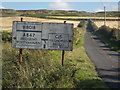 NR2564 : Isle of Islay: old road sign on the B8018 by Chris Downer