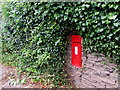 Victorian postbox in an ivy-clad Hereford Road wall, Monmouth