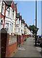 Pavement and long row of houses, Broad Street, Barry