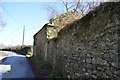 Roadside building opposite the church