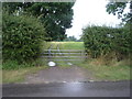 Gated farm track off Fauld Lane