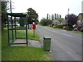 Elizabeth II postbox and bus shelter on the B5027, Bramshall