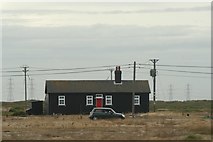 TR0917 : View of a large cottage in Dungeness from the beach by Robert Lamb